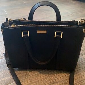 Black Kate Spade purse with top handle and strap